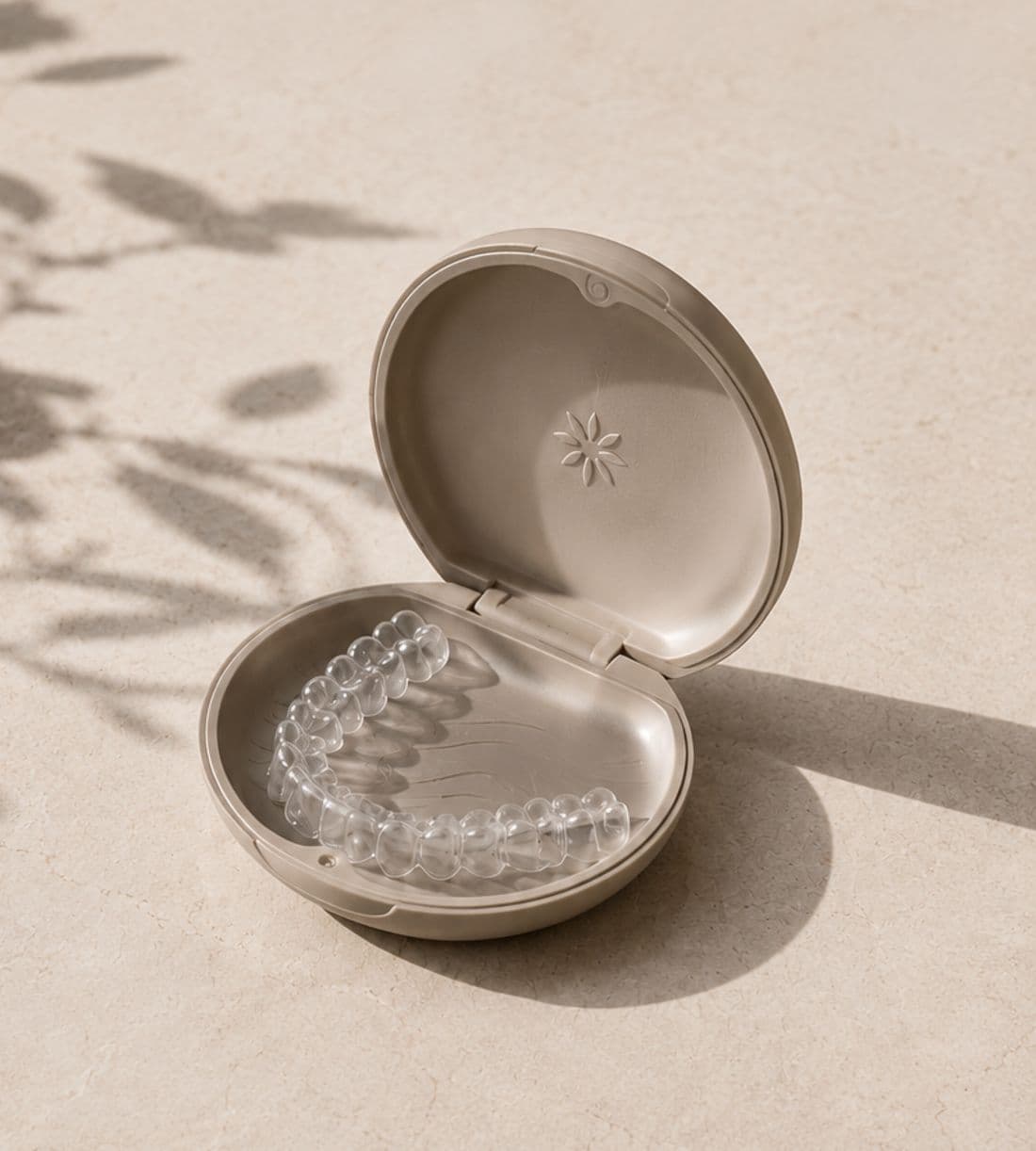 A clear Invisalign aligner tray resting on a ceramic dish at the Mountain View studio
