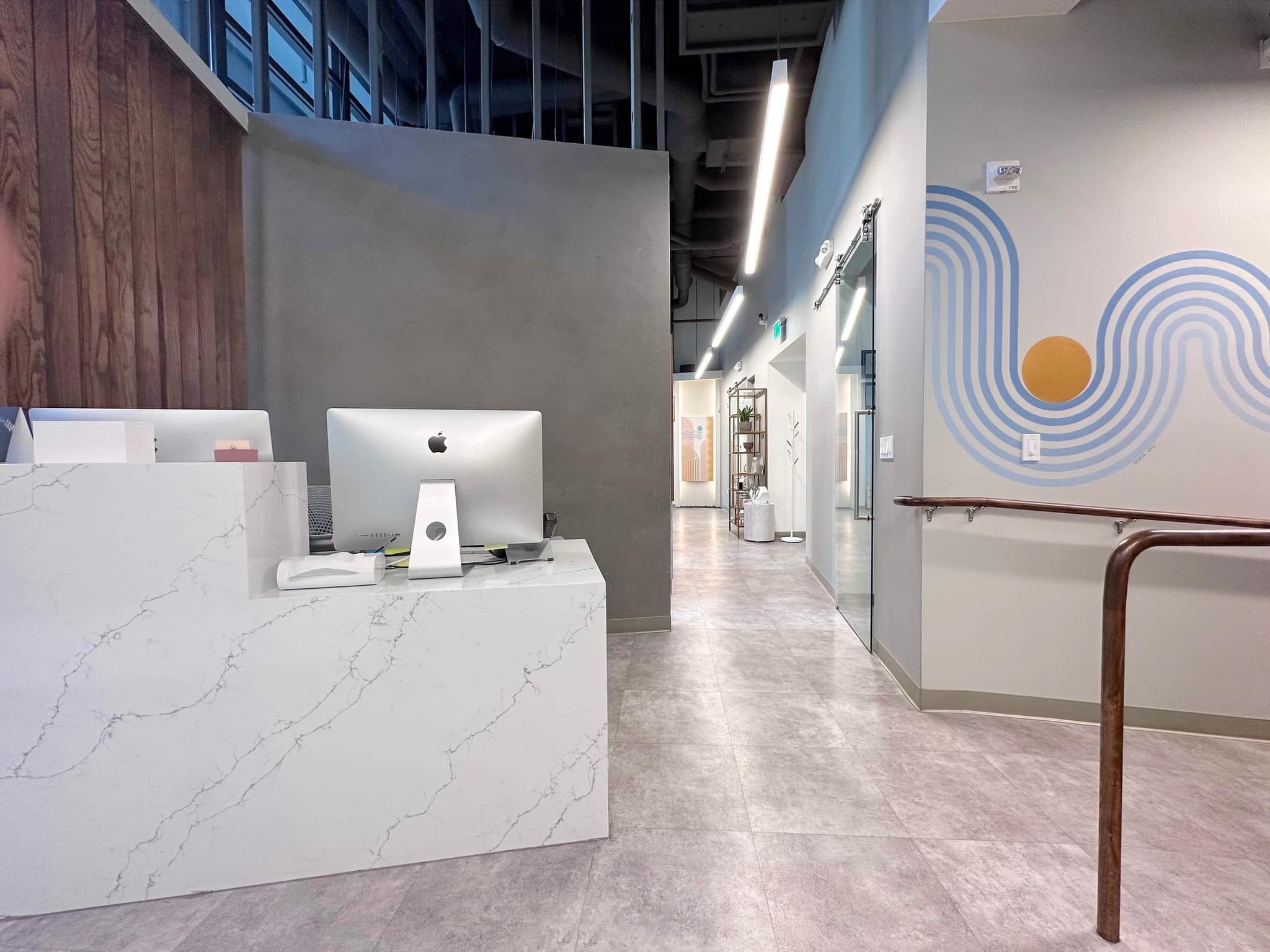 The quiet hallway connecting treatment rooms at the San Francisco studio